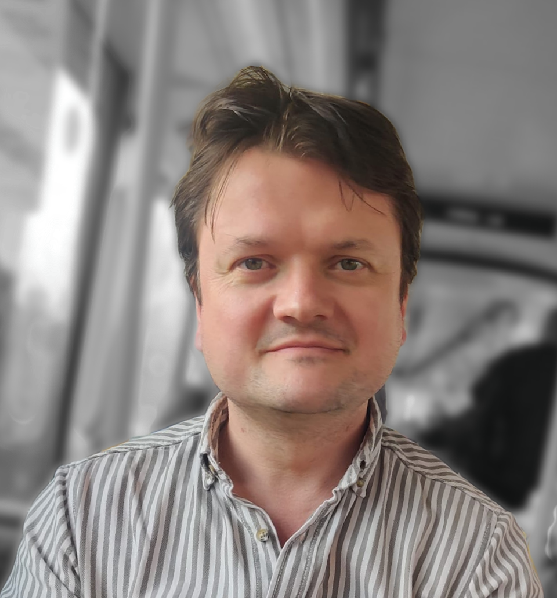 Professional portrait of Adam Banks, a UX research leader